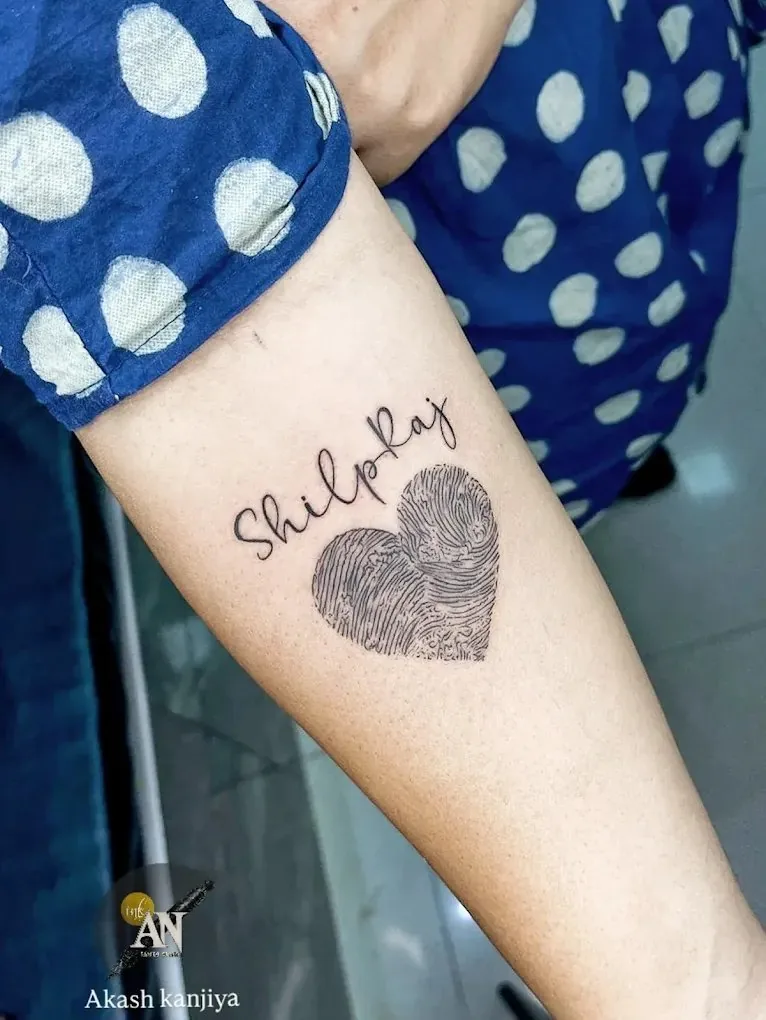 Fingerprint heart tattoo